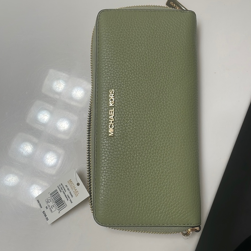 Light sage green NWT Michael Kors jet set travel wallet. Cute & never used.